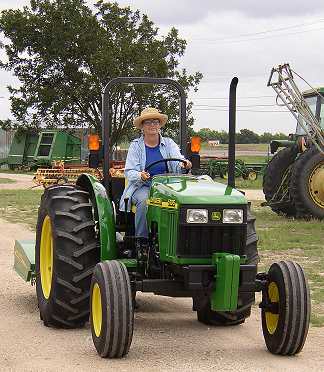 Elizabeth driving tractor